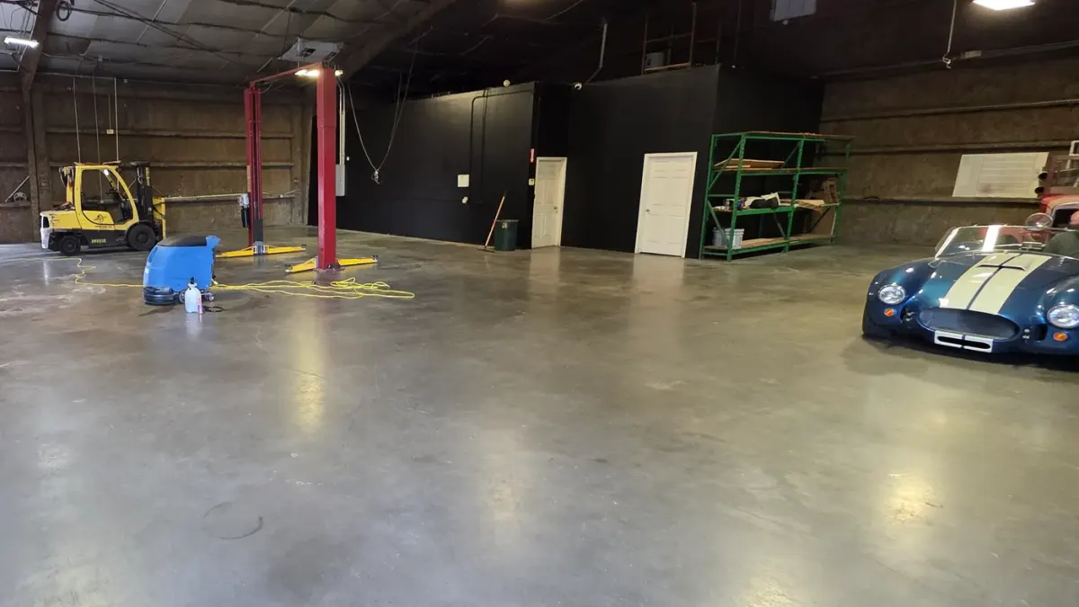 After: the same shop floor in Houston, uniform and clean after a first machine scrub by Maddox Surface